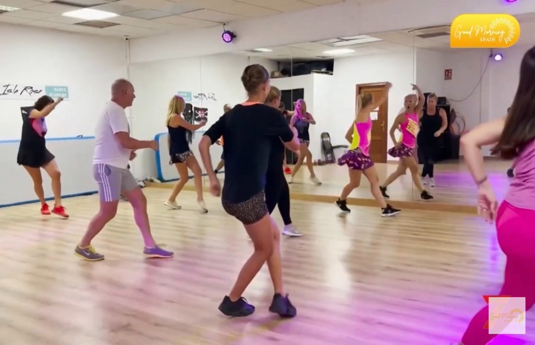 ObsessionSalsa Zumba class dancing together in the studio